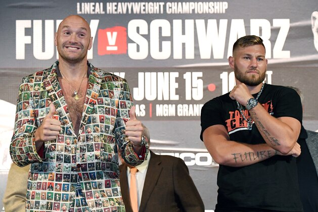 LAS VEGAS, NEVADA - JUNE 12:  Boxers Tyson Fury (L) and Tom Schwarz pose during a news conference at MGM Grand Hotel & Casino on June 12, 2019 in Las Vegas, Nevada. The two will meet in a heavyweight bout on June 15 at MGM Grand Garden Arena in Las Vegas.  (Photo by Ethan Miller/Getty Images)
