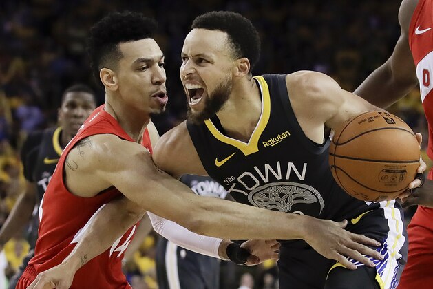 Golden State Warriors guard Stephen Curry, right, is defended by Toronto Raptors guard Danny Green during the second half of Game 4 of basketball's NBA Finals Friday, June 7, 2019, in Oakland, Calif. (AP Photo/Ben Margot)
