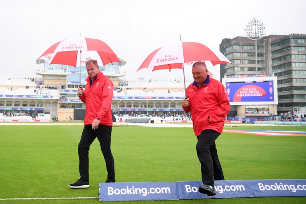 NOTTINGHAM, ENGLAND - JUNE 13:  Umpires Paul Reiffel and Marais Erasmus walk back to the Pavilion after calling off the Group Stage match of the ICC Cricket World Cup 2019 between India and New Zealand at Trent Bridge on June 13, 2019 in Nottingham, England. (Photo by Laurence Griffiths/Getty Images)