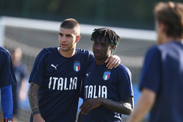 BOLOGNA, ITALY - JUNE 12:  Gianluca Mancini and Moise Kean of Italy chat during a Italy training session at Casteldebole Training Center on June 12, 2019 in Bologna, Italy.  (Photo by Claudio Villa/Getty Images)