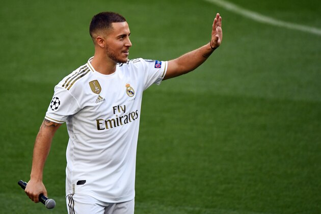 Belgian footballer Eden Hazard waves during his official presentation as new player of the Real Madrid CF at the Santiago Bernabeu stadium in Madrid on June 13, 2019. (Photo by GABRIEL BOUYS / AFP)        (Photo credit should read GABRIEL BOUYS/AFP/Getty Images)