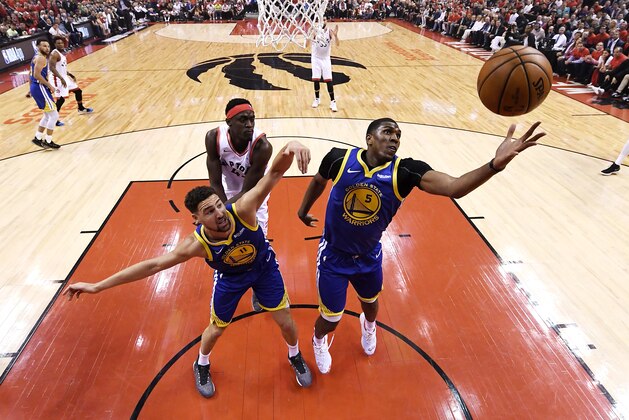TORONTO, ONTARIO - JUNE 10:  Kevon Looney #5 of the Golden State Warriors goes for the rebound against the Toronto Raptors during Game Five of the 2019 NBA Finals at Scotiabank Arena on June 10, 2019 in Toronto, Canada. NOTE TO USER: User expressly acknowledges and agrees that, by downloading and or using this photograph, User is consenting to the terms and conditions of the Getty Images License Agreement. (Photo by Pool - Kyle Terada/Getty Images)