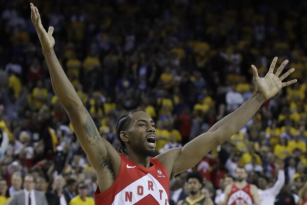 Toronto Raptors forward Kawhi Leonard celebrates after the Raptors defeated the Golden State Warriors in Game 6 of basketball's NBA Finals in Oakland, Calif., Thursday, June 13, 2019. (AP Photo/Ben Margot)