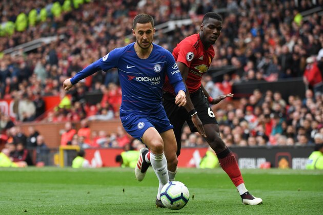Chelsea's Belgian midfielder Eden Hazard (L) beats Manchester United's French midfielder Paul Pogba (R) during the English Premier League football match between Manchester United and Chelsea at Old Trafford in Manchester, north west England, on April 28, 2019. (Photo by Paul ELLIS / AFP) / RESTRICTED TO EDITORIAL USE. No use with unauthorized audio, video, data, fixture lists, club/league logos or 'live' services. Online in-match use limited to 120 images. An additional 40 images may be used in extra time. No video emulation. Social media in-match use limited to 120 images. An additional 40 images may be used in extra time. No use in betting publications, games or single club/league/player publications. /         (Photo credit should read PAUL ELLIS/AFP/Getty Images)