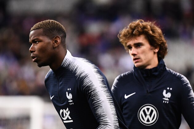 France's midfielder Paul Pogba (L) and France's forward Antoine Griezmann warm up ahead of the UEFA Euro 2020 Group H qualification football match between France and Iceland at the Stade de France stadium in Saint-Denis, north of Paris, on March 25, 2019. (Photo by FRANCK FIFE / AFP)        (Photo credit should read FRANCK FIFE/AFP/Getty Images)