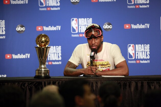 OAKLAND, CA - JUNE 13:  Kawhi Leonard #2 of the Toronto Raptors talks to the media during a press conference with the Larry O'Brien Trophy after Game Six of the NBA Finals against the Golden State Warriors in Game Six of the NBA Finals on June 13, 2019 at Oracle Arena in Oakland, California. NOTE TO USER: User expressly acknowledges and agrees that, by downloading and/or using this photograph, user is consenting to the terms and conditions of the Getty Images License Agreement. Mandatory Copyright Notice: Copyright 2019 NBAE (Photo by Jack Arent/NBAE via Getty Images)