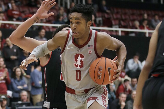 Stanford forward KZ Okpala (0) drives to the basket in front of Utah forward Timmy Allen during the second half of an NCAA college basketball game in Stanford, Calif., Thursday, Jan. 24, 2019. (AP Photo/Jeff Chiu)