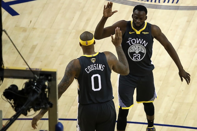 OAKLAND, CALIFORNIA - JUNE 07:  DeMarcus Cousins #0 and Draymond Green #23 of the Golden State Warriors celebrate against the Toronto Raptors in the second half during Game Four of the 2019 NBA Finals at ORACLE Arena on June 07, 2019 in Oakland, California. NOTE TO USER: User expressly acknowledges and agrees that, by downloading and or using this photograph, User is consenting to the terms and conditions of the Getty Images License Agreement. (Photo by Ezra Shaw/Getty Images)
