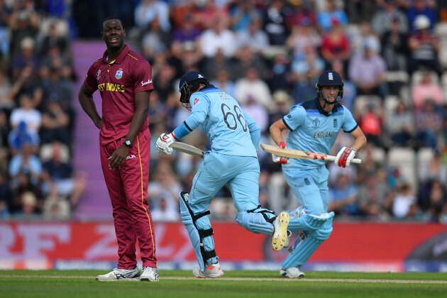 SOUTHAMPTON, ENGLAND - JUNE 14: Sheldon Cottrell of West Indies can only look on as Joe Root and Chris Woakes of England take another run during the Group Stage match of the ICC Cricket World Cup 2019 between England and West Indies at The Hampshire Bowl on June 14, 2019 in Southampton, England. (Photo by Mike Hewitt/Getty Images)