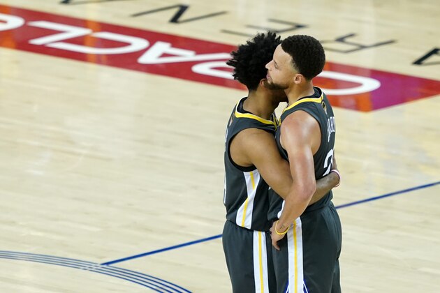 OAKLAND, CALIFORNIA - JUNE 13:  Quinn Cook #4 and Stephen Curry #30 of the Golden State Warriors embrace late in the game against the Toronto Raptors during Game Six of the 2019 NBA Finals at ORACLE Arena on June 13, 2019 in Oakland, California. NOTE TO USER: User expressly acknowledges and agrees that, by downloading and or using this photograph, User is consenting to the terms and conditions of the Getty Images License Agreement. (Photo by Thearon W. Henderson/Getty Images)