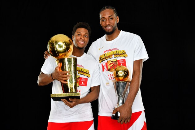 OAKLAND, CA - JUNE 13: Kyle Lowry #7 and Kawhi Leonard #2 of the Toronto Raptors pose for a portrait with the Larry O'Brien Trophy after winning Game Six of the 2019 NBA Finals against the Golden State Warriors on June 13, 2019 at ORACLE Arena in Oakland, California. NOTE TO USER: User expressly acknowledges and agrees that, by downloading and/or using this photograph, user is consenting to the terms and conditions of Getty Images License Agreement. Mandatory Copyright Notice: Copyright 2019 NBAE (Photo by Jesse D. Garrabrant/NBAE via Getty Images)
