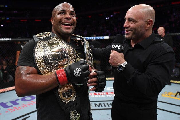 NEW YORK, NY - NOVEMBER 03:  Daniel Cormier is interviewed by Joe Rogan after his submission victory over Derrick Lewis in their UFC heavyweight championship bout during the UFC 230 event inside Madison Square Garden on November 3, 2018 in New York, New York. (Photo by Jeff Bottari/Zuffa LLC/Zuffa LLC via Getty Images)