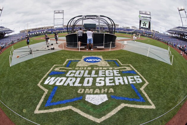 The College World Series logo is partially painted at TD Ameritrade Park in Omaha, Neb., Friday, June 14, 2019, as Vanderbilt players practice ahead of their College World Series game against Louisville on Sunday. (AP Photo/Nati Harnik)