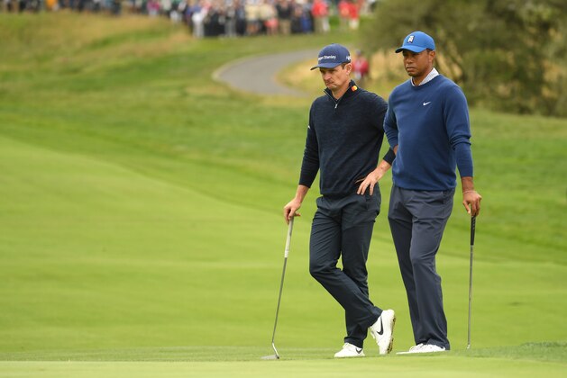 PEBBLE BEACH, CALIFORNIA - JUNE 14: Justin Rose of England (L) and Tiger Woods of the United States look on from the second green during the second round of the 2019 U.S. Open at Pebble Beach Golf Links on June 14, 2019 in Pebble Beach, California. (Photo by Ross Kinnaird/Getty Images)