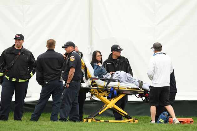 PEBBLE BEACH, CALIFORNIA - JUNE 14: Medical attention  is administered after an incident involving a golf cart on the 16th hole during the second round of the 2019 U.S. Open at Pebble Beach Golf Links on June 14, 2019 in Pebble Beach, California. (Photo by Ross Kinnaird/Getty Images)