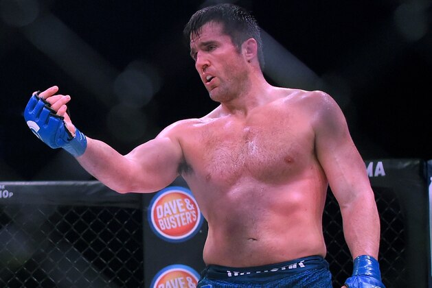 INGLEWOOD, CA - JANUARY 20:  Chael Sonnen (blue gloves) stands in the cage as he defeated Quinton Jackson (not pictured) in their Heavyweight World Title fight at Bellator 192 at The Forum on January 20, 2018 in Inglewood, California.  (Photo by Jayne Kamin-Oncea/Getty Images)