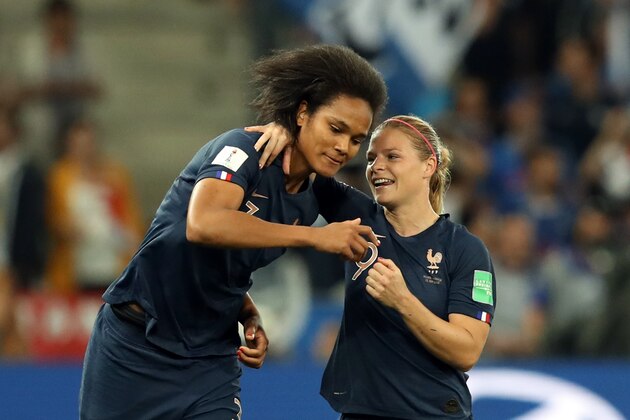 TOPSHOT - France's forward Eugenie Le Sommer (R) celebrates with France's defender Wendie Renard after scoring a goal during the France 2019 Women's World Cup Group A football match between France and Norway, on June 12, 2019, at the Nice Stadium in Nice, southeastern France. (Photo by Valery HACHE / AFP)        (Photo credit should read VALERY HACHE/AFP/Getty Images)