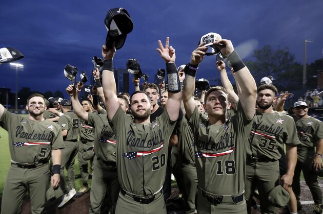 Vanderbilt's Philip Clarke (5), Ty Duvall (20), Pat DeMarco (18) and the rest of the team tip their hats to fans after an NCAA college super regional baseball game against Duke Sunday, June 9, 2019, in Nashville, Tenn. Vanderbilt won 13-2 to advance. (AP Photo/Wade Payne)