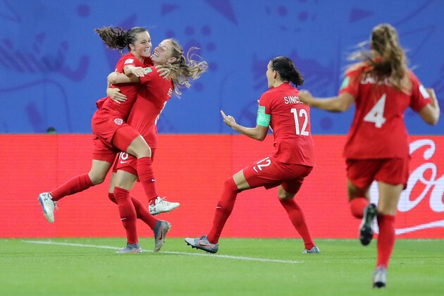 GRENOBLE, FRANCE - JUNE 15: Jessie Fleming of Canada celebrates with teammate Janine Beckie after scoring her team's first goal during the 2019 FIFA Women's World Cup France group E match between Canada and New Zealand at Stade des Alpes on June 15, 2019 in Grenoble, France. (Photo by Elsa/Getty Images)