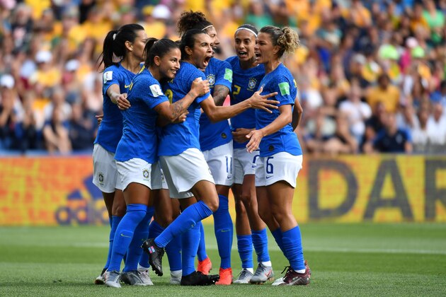Brazil's forward Marta (C) celebrates with teammates after scoring a  penalty kick   during the France 2019 Women's World Cup Group C football match between Australia and Brazil, on June 13, 2019, at the Mosson Stadium in Montpellier, southern France. (Photo by Pascal GUYOT / AFP)        (Photo credit should read PASCAL GUYOT/AFP/Getty Images)