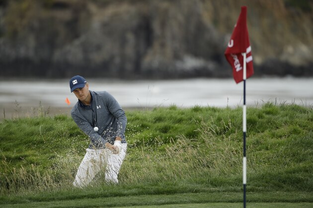 Jordan Spieth hits out of the bunker on the 17th hole during the second round of the U.S. Open Championship golf tournament Friday, June 14, 2019, in Pebble Beach, Calif. (AP Photo/Marcio Jose Sanchez)