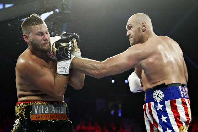 Tyson Fury, of England, lands a left to Tom Schwarz, of Germany, during a heavyweight boxing match Saturday, June 15, 2019, in Las Vegas. (AP Photo/John Locher)