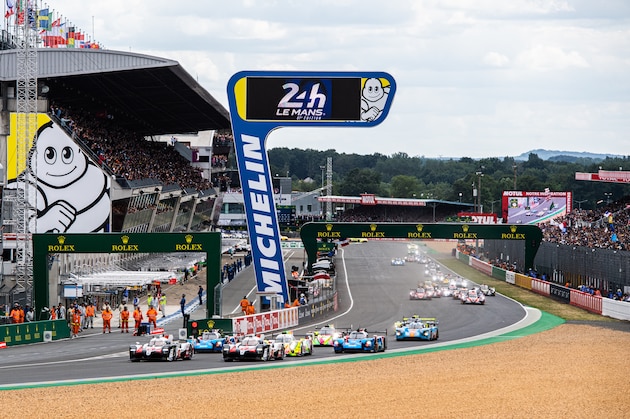 LE MANS, FRANCE - JUNE 15: (L to R): The #08 Toyota Gazoo Racing TS050 Hybrid of Sebastien Buemi, Kazuki Nakajima, and Fernando Alonso and the #07 Toyota Gazoo Racing TS050 Hybrid of Mike Conway, Kamui Kobayashi, and Jose Maria Lopez in action at the start of the race during the Le Mans 24 Hour Race at the Circuit de la Sarthe on June 15, 2019 in Le Mans, France. (Photo by James Moy Photography/Getty Images)