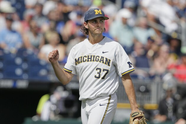 Michigan starting pitcher Karl Kauffmann (37) pumps his fist as he walks off the mound following the seventh inning of an NCAA College World Series baseball game against Texas Tech in Omaha, Neb., Saturday, June 15, 2019. Michigan won 5-3. (AP Photo/Nati Harnik)