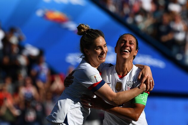 United States' forward Carli Lloyd (R) celebrates with teammates after scoring a goal during the France 2019 Women's World Cup Group F football match between USA and Chile, on June 16, 2019, at the Parc des Princes stadium in Paris. (Photo by FRANCK FIFE / AFP)        (Photo credit should read FRANCK FIFE/AFP/Getty Images)