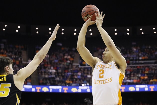 Tennessee's Grant Williams (2) shoots over Iowa's Luka Garza (55) In the second half during a second-round men's college basketball game in the NCAA Tournament, Sunday, March 24, 2019, in Columbus, Ohio. (AP Photo/John Minchillo)