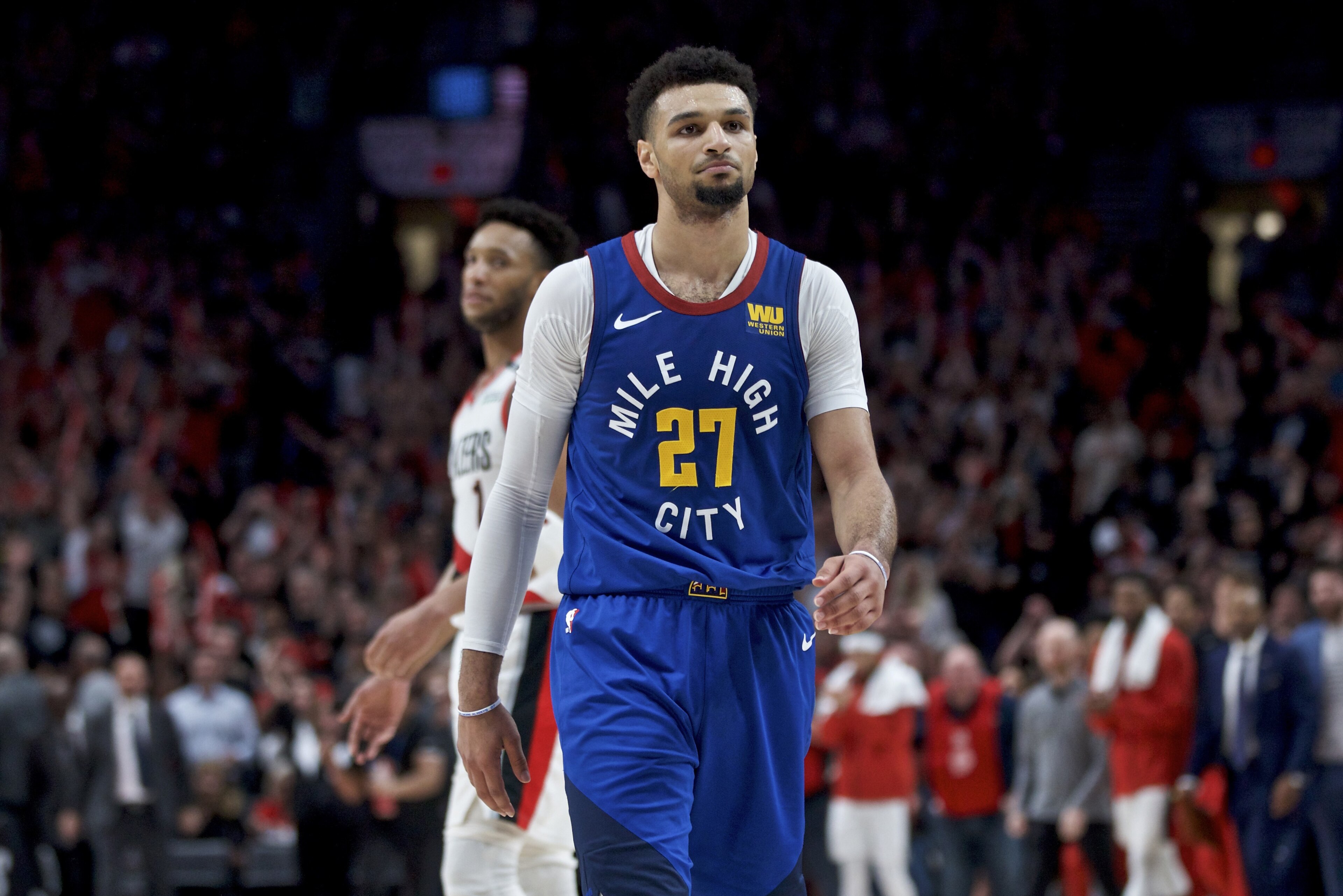 Denver Nuggets guard Jamal Murray walks off the court after the team's loss to the Portland Trail Blazers in Game 6 of an NBA basketball second-round playoff series Thursday, May 9, 2019, in Portland, Ore. The Trail Blazers won 119-108. (AP Photo/Craig Mitchelldyer)