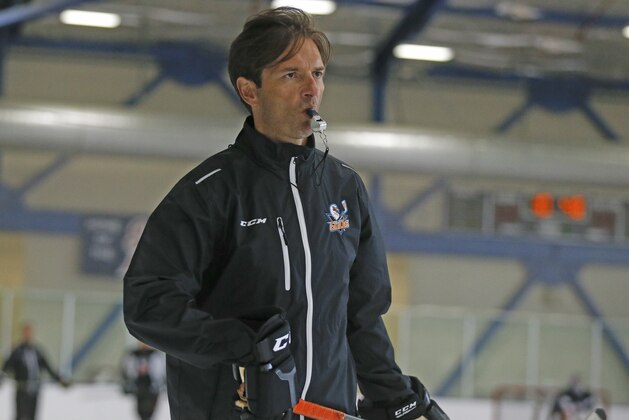 ADVANCE FOR USE SATURDAY, OCT. 10 - San Diego Gulls coach Dallas Eakins watches during hockey practice, Thursday, Oct. 8, 2015, in San Diego. Less than a year removed from being fired in mid-season by the Edmonton Oilers, Eakins professes not to be in a rush to get back to the NHL as he begins to develop the top farm team for the Anaheim Ducks, who play just 90 minutes up the freeway. (AP Photo/Lenny Ignelzi)