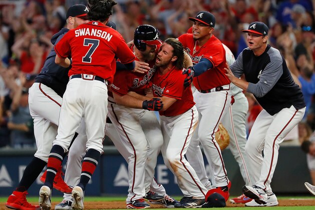 ATLANTA, GEORGIA - JUNE 14:  Brian McCann #16 of the Atlanta Braves reacts after hitting a walk-off single to score two runs to give the Braves a 9-8 win over the Philadelphia Phillies at SunTrust Park on June 14, 2019 in Atlanta, Georgia. (Photo by Kevin C. Cox/Getty Images)
