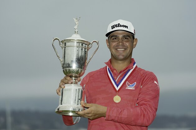Gary Woodland posses with the trophy after winning the U.S. Open Championship golf tournament Sunday, June 16, 2019, in Pebble Beach, Calif. (AP Photo/Carolyn Kaster)