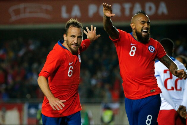 photo released by Photosport via Aton showing Chile's Jose Fuenzalida (L) celebrating with teammate Arturo Vidal after scoring against Haiti during the friendly match held at the La Portada stadium in La Serena, Chile, on June 06, 2019. (Photo by ANDRES PINA / Photosport Chile / AFP) / Chile OUT / RESTRICTED TO EDITORIAL USE - MANDATORY CREDIT