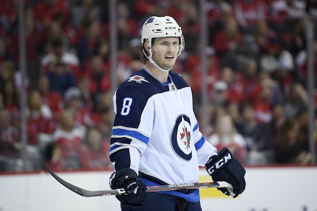 Winnipeg Jets defenseman Jacob Trouba (8) stands on the ice during the first period of an NHL hockey game against the Washington Capitals, Sunday, March 10, 2019, in Washington. (AP Photo/Nick Wass)