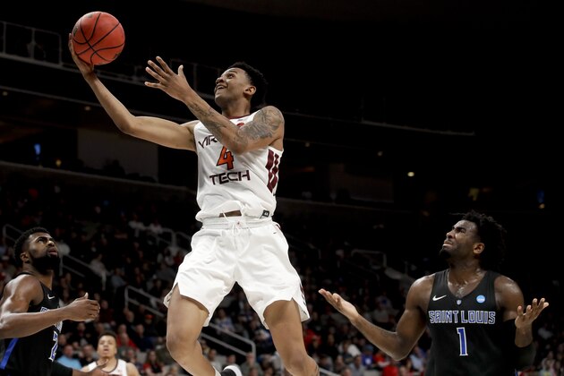 Virginia Tech guard Nickeil Alexander-Walker scores past Saint Louis forward D.J. Foreman, right, during the first half of a first-round game in the NCAA men's college basketball tournament Friday, March 22, 2019, in San Jose, Calif. (AP Photo/Jeff Chiu)