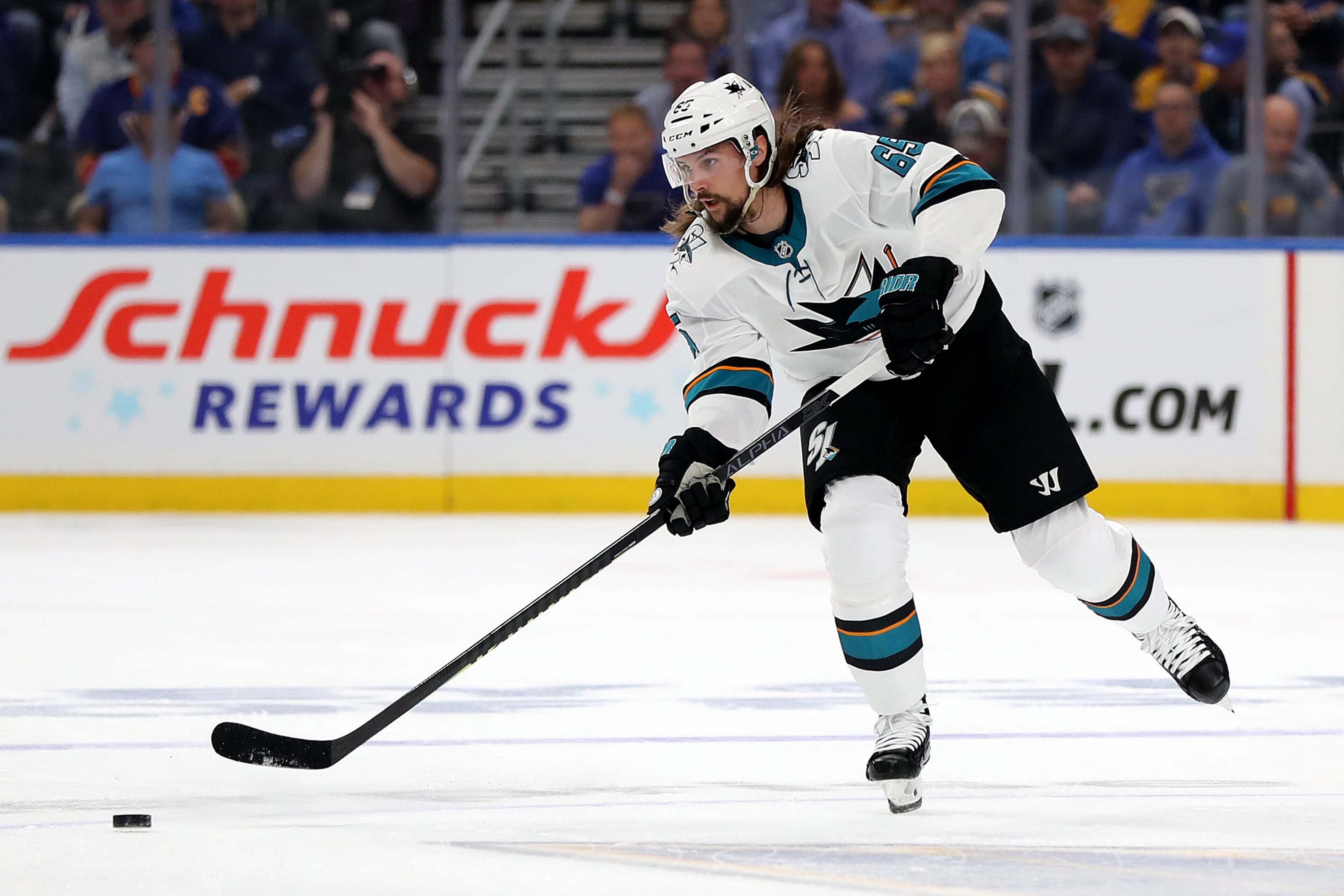ST LOUIS, MISSOURI - MAY 15: Erik Karlsson #65 of the San Jose Sharks passes the puck against the St. Louis Blues during the first period in Game Three of the Western Conference Finals during the 2019 NHL Stanley Cup Playoffs at Enterprise Center on May 15, 2019 in St Louis, Missouri. (Photo by Elsa/Getty Images)