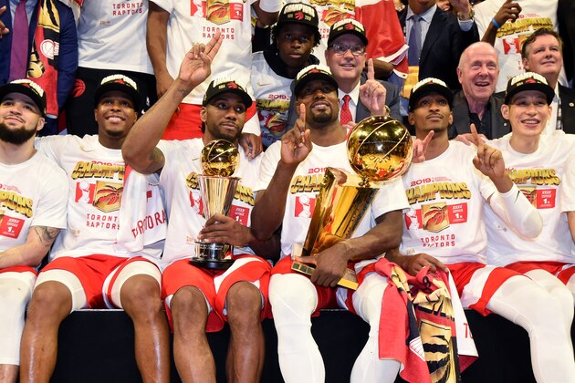 OAKLAND, CA - JUNE 13: Kawhi Leonard #2 holds up the Bill Russell NBA Finals Most Valuable Player Award and Serge Ibaka #9 of the Toronto Raptors holds up the Larry O'Brien Championship Trophy after Game Six of the NBA Finals against the Golden State Warriors on June 13, 2019 at ORACLE Arena in Oakland, California. NOTE TO USER: User expressly acknowledges and agrees that, by downloading and/or using this photograph, user is consenting to the terms and conditions of Getty Images License Agreement. Mandatory Copyright Notice: Copyright 2019 NBAE (Photo by Andrew D. Bernstein/NBAE via Getty Images)