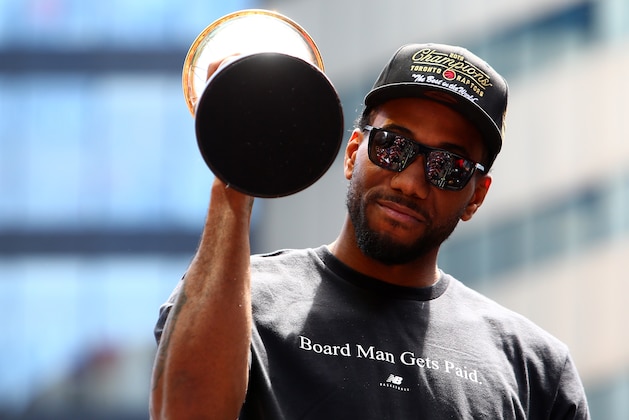 TORONTO, ON - JUNE 17:  Kawhi Leonard #2 of the Toronto Raptors holds the MVP trophy during the Toronto Raptors Victory Parade on June 17, 2019 in Toronto, Canada. The Toronto Raptors beat the Golden State Warriors 4-2 to win the 2019 NBA Finals.  NOTE TO USER: User expressly acknowledges and agrees that, by downloading and or using this photograph, User is consenting to the terms and conditions of the Getty Images License Agreement.  (Photo by Vaughn Ridley/Getty Images)