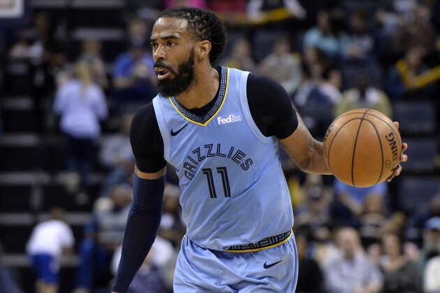 Memphis Grizzlies guard Mike Conley (11) handles the ball in the second half of an NBA basketball game against the Orlando Magic Sunday, March 10, 2019, in Memphis, Tenn. (AP Photo/Brandon Dill)