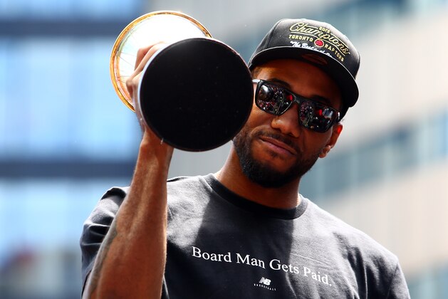 TORONTO, ON - JUNE 17:  Kawhi Leonard #2 of the Toronto Raptors holds the MVP trophy during the Toronto Raptors Victory Parade on June 17, 2019 in Toronto, Canada. The Toronto Raptors beat the Golden State Warriors 4-2 to win the 2019 NBA Finals.  NOTE TO USER: User expressly acknowledges and agrees that, by downloading and or using this photograph, User is consenting to the terms and conditions of the Getty Images License Agreement.  (Photo by Vaughn Ridley/Getty Images)
