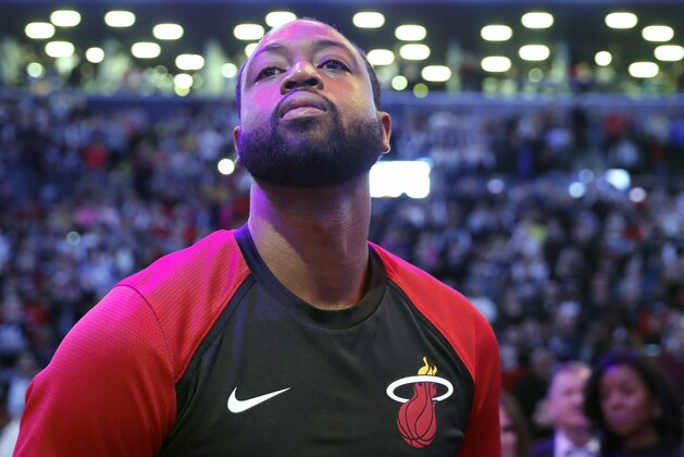 Miami Heat guard Dwyane Wade looks across the court after the National Anthem before the final NBA basketball game of his career, Wednesday, April 10, 2019, against the Brooklyn Nets in New York. (AP Photo/Kathy Willens)