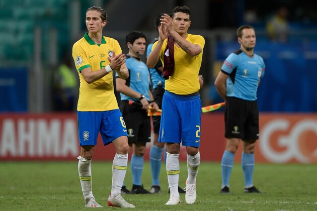 Brazil's Filipe Luis (L) and Thiago Silva acknowledge the crowd after tying 0-0 with Venezuela in a Copa America football tournament group match at the Fonte Nova Arena in Salvador, Brazil, on June 18, 2019. (Photo by Juan MABROMATA / AFP)        (Photo credit should read JUAN MABROMATA/AFP/Getty Images)