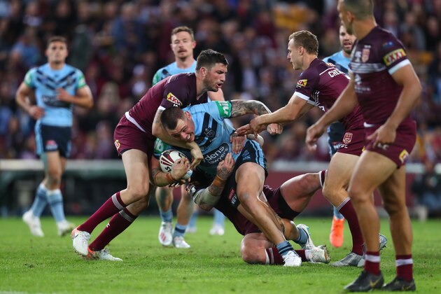 BRISBANE, AUSTRALIA - JUNE 05: David Klemmer of the Blues is tackled during game one of the 2019 State of Origin series between the Queensland Maroons and the New South Wales Blues at Suncorp Stadium on June 05, 2019 in Brisbane, Australia. (Photo by Chris Hyde/Getty Images)