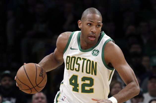 Boston Celtics center Al Horford (42) handles the ball in the first quarter of an NBA basketball game, Friday, March 1, 2019, in Boston. (AP Photo/Elise Amendola)