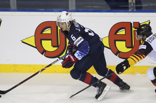 Germany's Markus Eisenschmid, right, challenges Jack Hughes of the US, left, during the Ice Hockey World Championships group A match between Germany and the United States at the Steel Arena in Kosice, Slovakia, Sunday, May 19, 2019. (AP Photo/Petr David Josek)