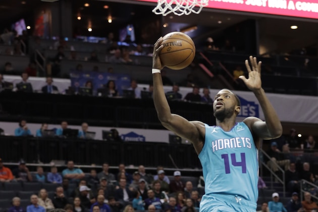 Charlotte Hornets forward Michael Kidd-Gilchrist (14) drives to the basket against the Washington Wizards during the first half of an NBA basketball game in Charlotte, N.C., Friday, Feb. 22, 2019. (AP Photo/Chuck Burton)