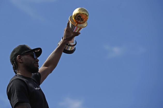 TORONTO, ON - JUNE 17:  Kawhi Leonard #2 of the Toronto Raptors holds the Bill Russell MVP Trophy during the Toronto Raptors Championship Victory Parade on June 17, 2019 in Toronto, Ontario. NOTE TO USER: User expressly acknowledges and agrees that, by downloading and/or using this photograph, user is consenting to the terms and conditions of Getty Images License Agreement. Mandatory Copyright Notice: Copyright 2019 NBAE (Photo by Mark Blinch/NBAE via Getty Images)