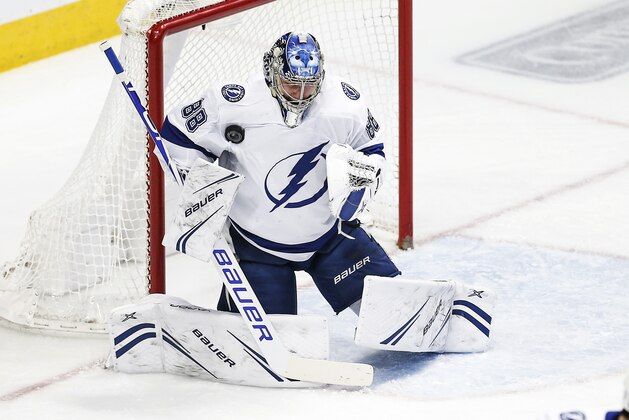 Tampa Bay Lightning goaltender Andrei Vasilevskiy (88) stops a shot on goal during the first period of an NHL hockey game against the Dallas Stars, Tuesday, Jan. 15, 2019, in Dallas. Tampa bay won 2-0. (AP Photo/Brandon Wade)